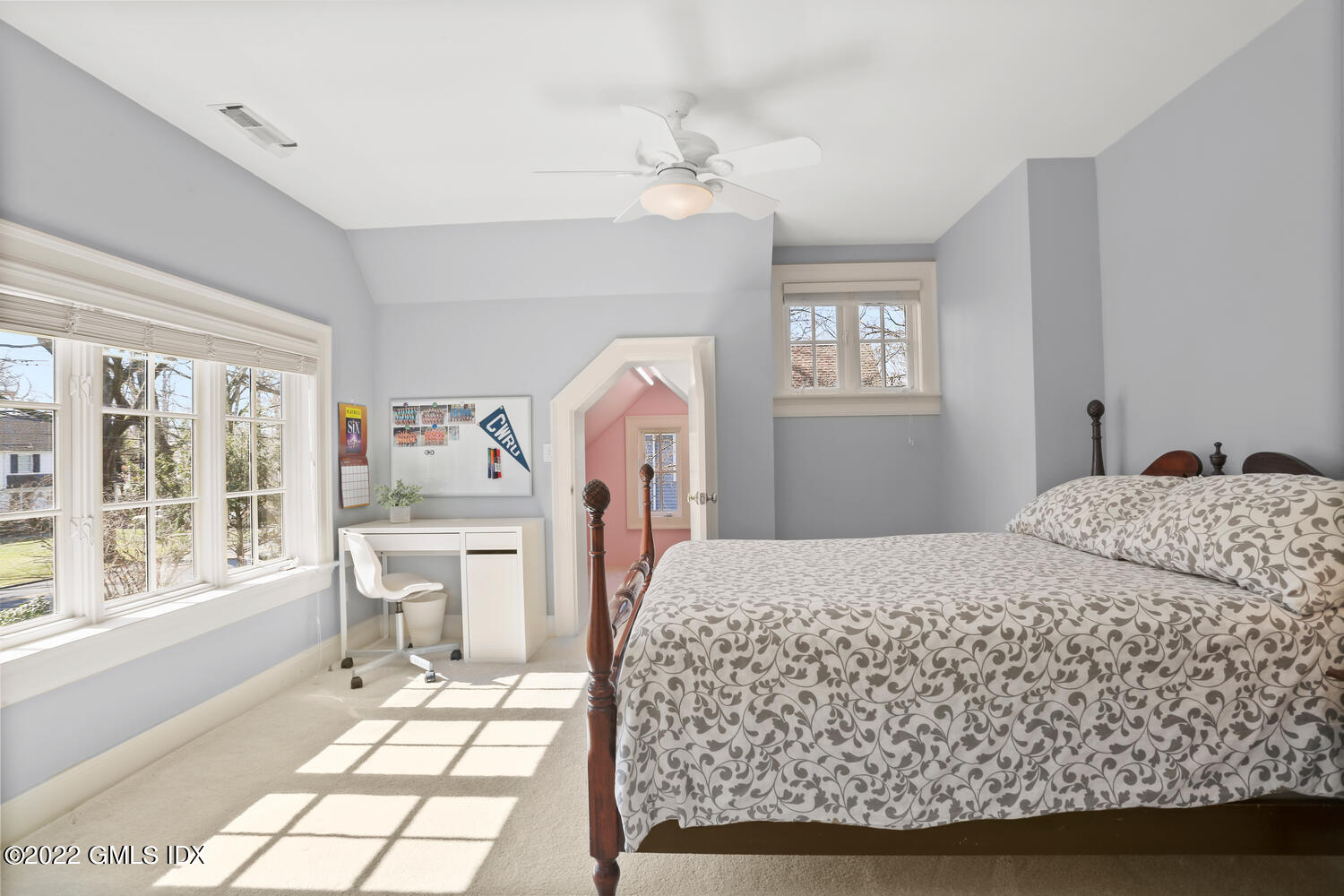 7 Owenoke Way Riverside, CT 06878 - Photo 28 of 37 a bedroom with a bed wooden floor and window