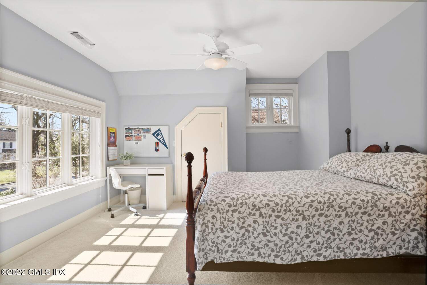 7 Owenoke Way Riverside, CT 06878 - Photo 29 of 37 a living room with a bed furniture and a window
