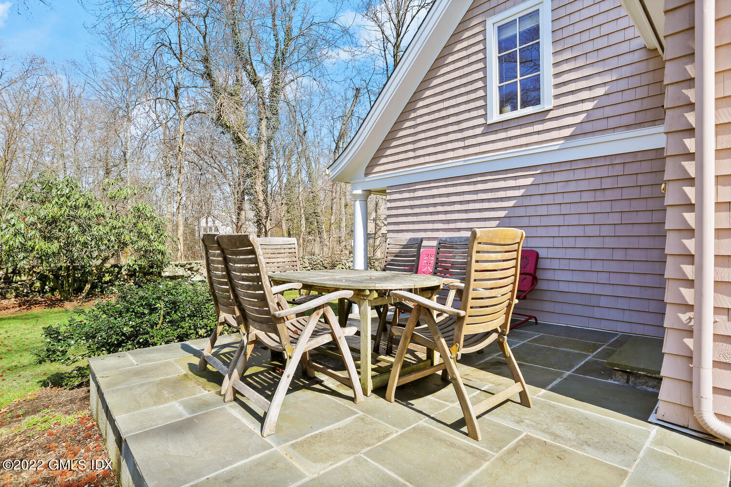 7 Owenoke Way Riverside, CT 06878 - Photo 34 of 37 a view of a patio with table and chairs with wooden floor and fence