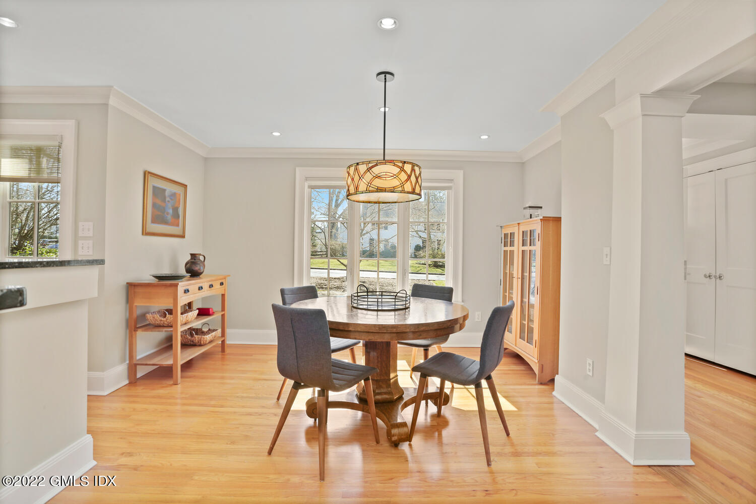 7 Owenoke Way Riverside, CT 06878 - Photo 9 of 37 a dining room with furniture a chandelier and wooden floor