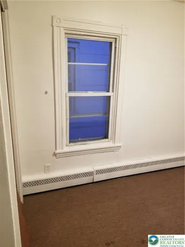 a view of a storage & utility room with a sink
