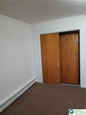 an empty room with a gallery