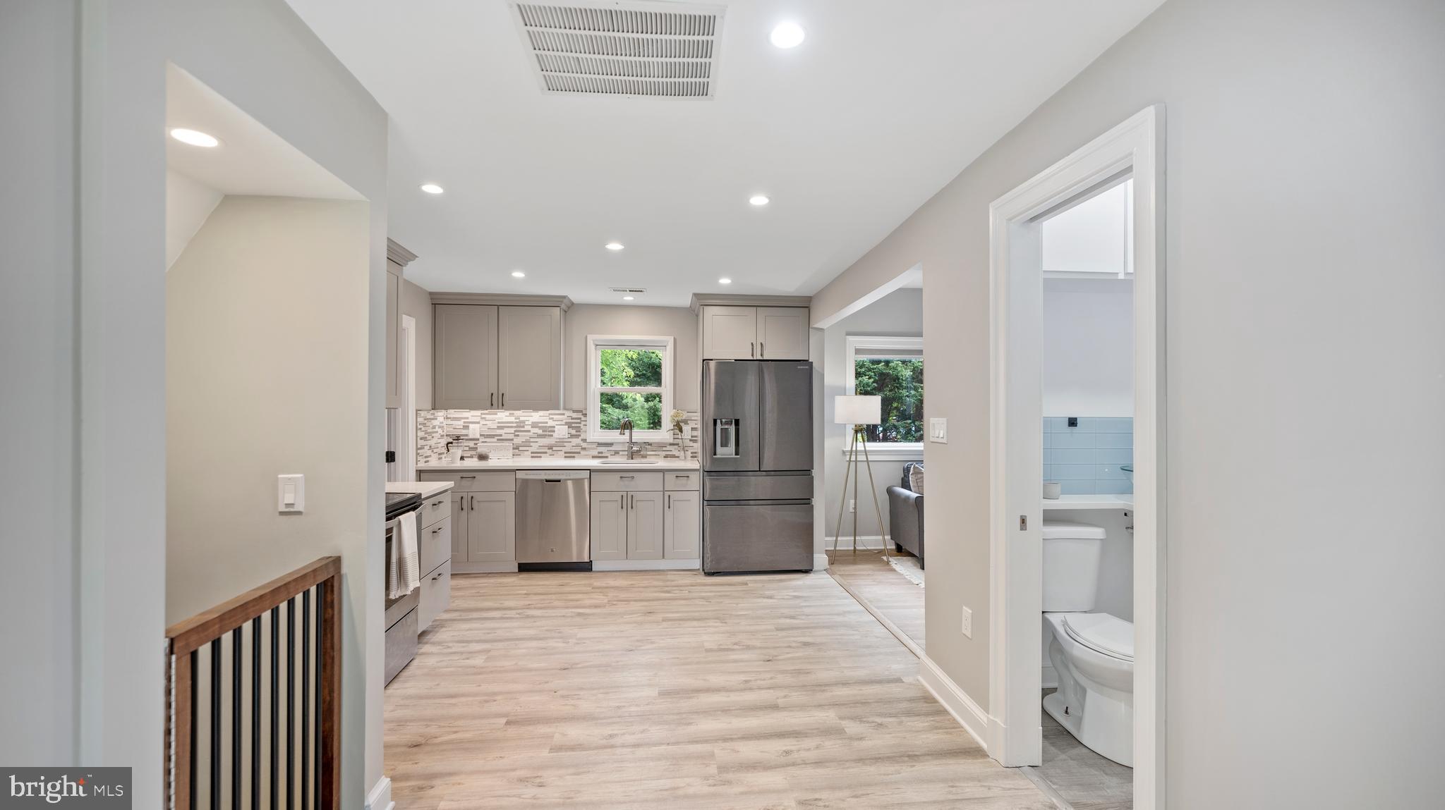 15705 Barnesville Road Boyds, MD 20841 - Photo 13 of 49 a kitchen with a refrigerator and a sink