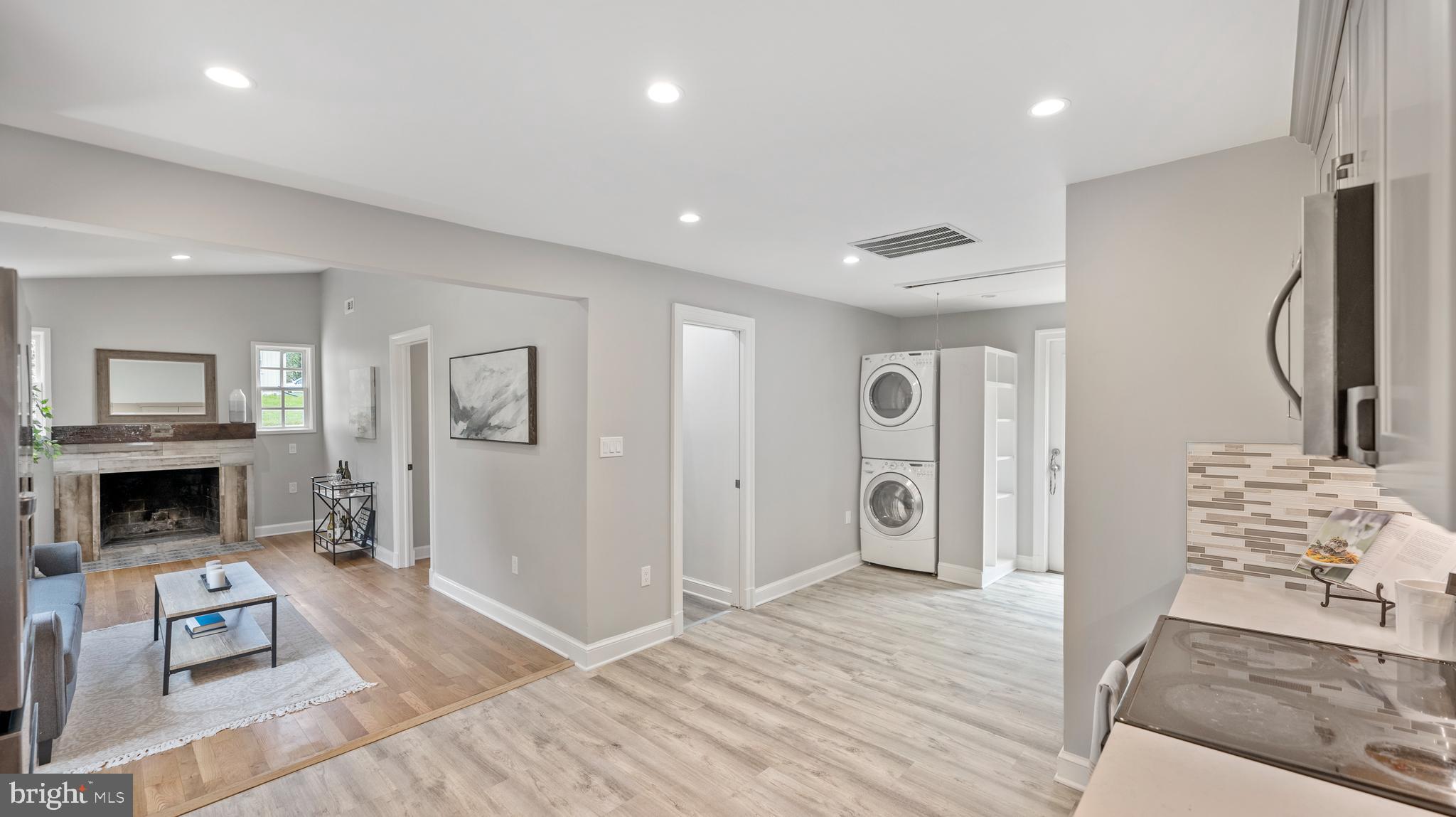15705 Barnesville Road Boyds, MD 20841 - Photo 14 of 49 a view of a livingroom with a fireplace wooden floor and entryway