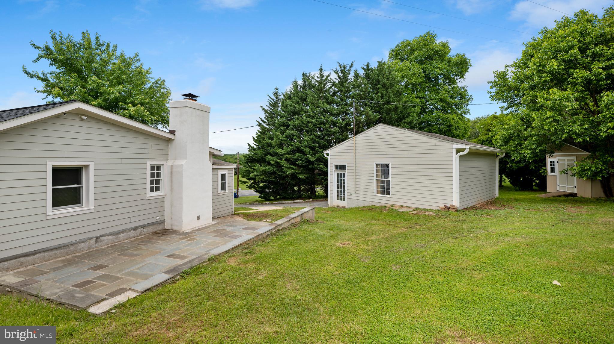 15705 Barnesville Road Boyds, MD 20841 - Photo 45 of 49 a front view of house with yard and trees in the background