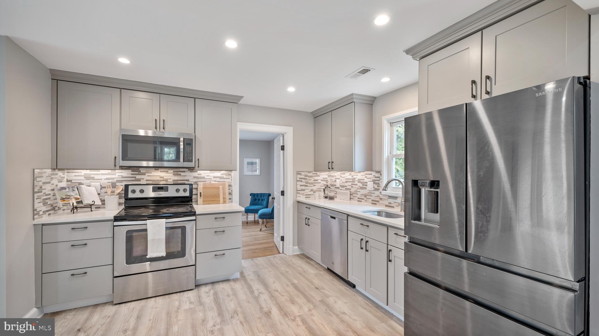 15705 Barnesville Road Boyds, MD 20841 - Photo 8 of 49 a kitchen with stainless steel appliances a refrigerator stove and microwave