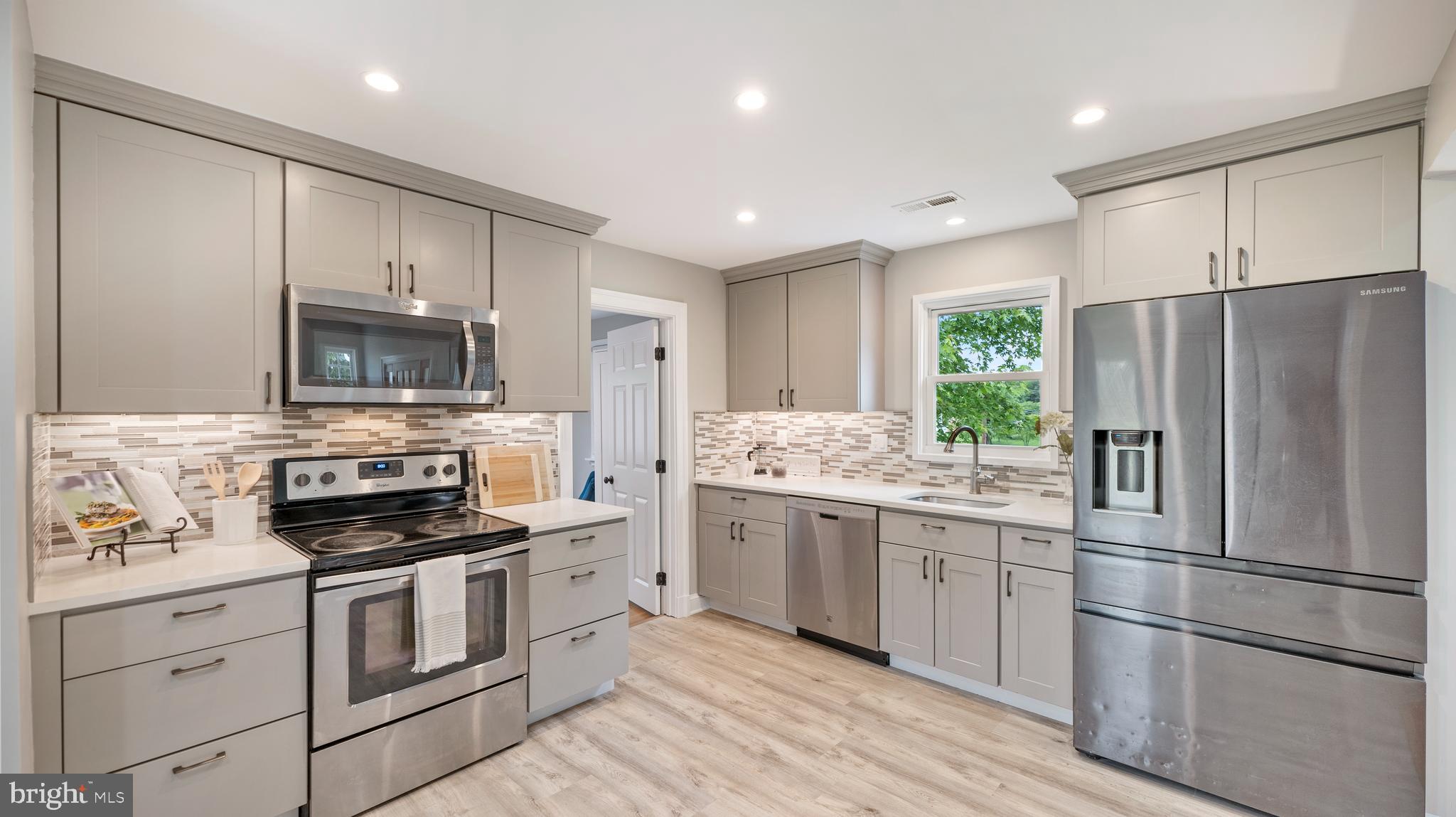 15705 Barnesville Road Boyds, MD 20841 - Photo 9 of 49 a kitchen with a refrigerator stove and sink