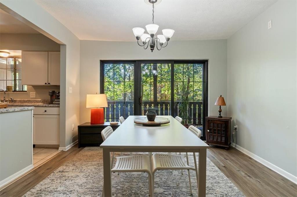 703 Timber Lane Sewickley, PA 15143 - Photo 11 of 30 a kitchen with a stove a table and chairs in it