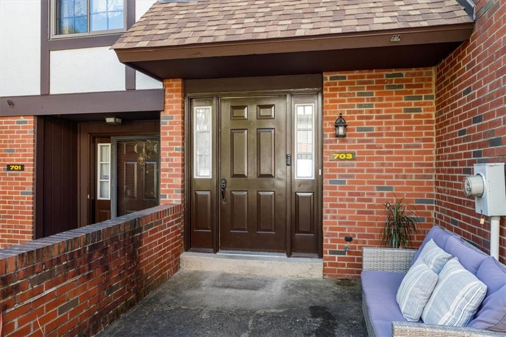 703 Timber Lane Sewickley, PA 15143 - Photo 3 of 30 a view of a porch with a table and chairs