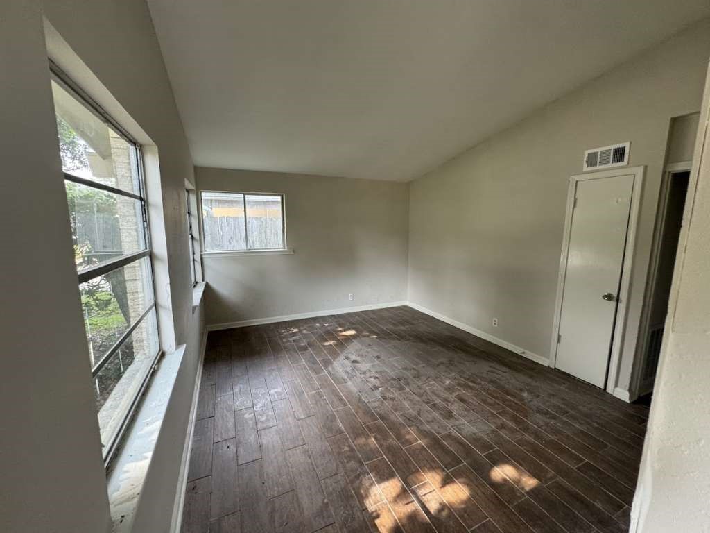 270 Triangle Drive Vidor, TX 77662 - Photo 11 of 27 an empty room with wooden floor and windows