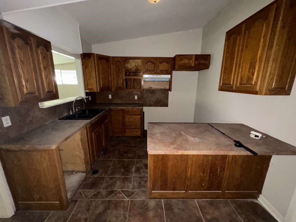 270 Triangle Drive Vidor, TX 77662 - Photo 17 of 27 a kitchen with a sink and a stove top oven