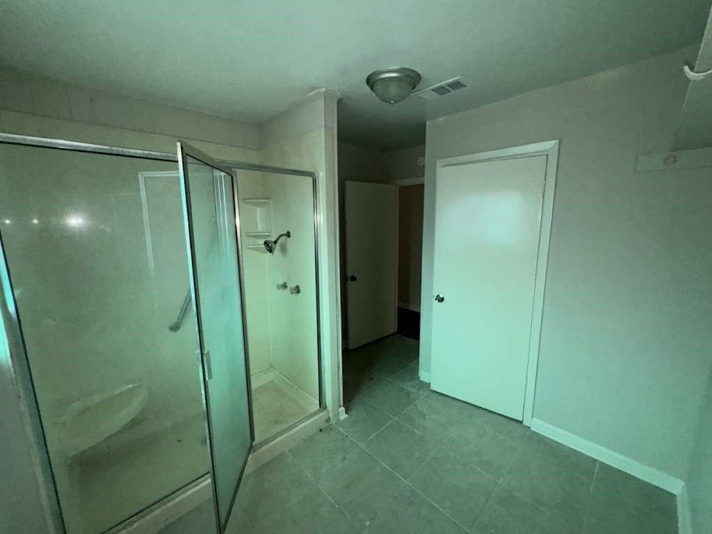 270 Triangle Drive Vidor, TX 77662 - Photo 22 of 29 a bathroom with a shower and a glass door