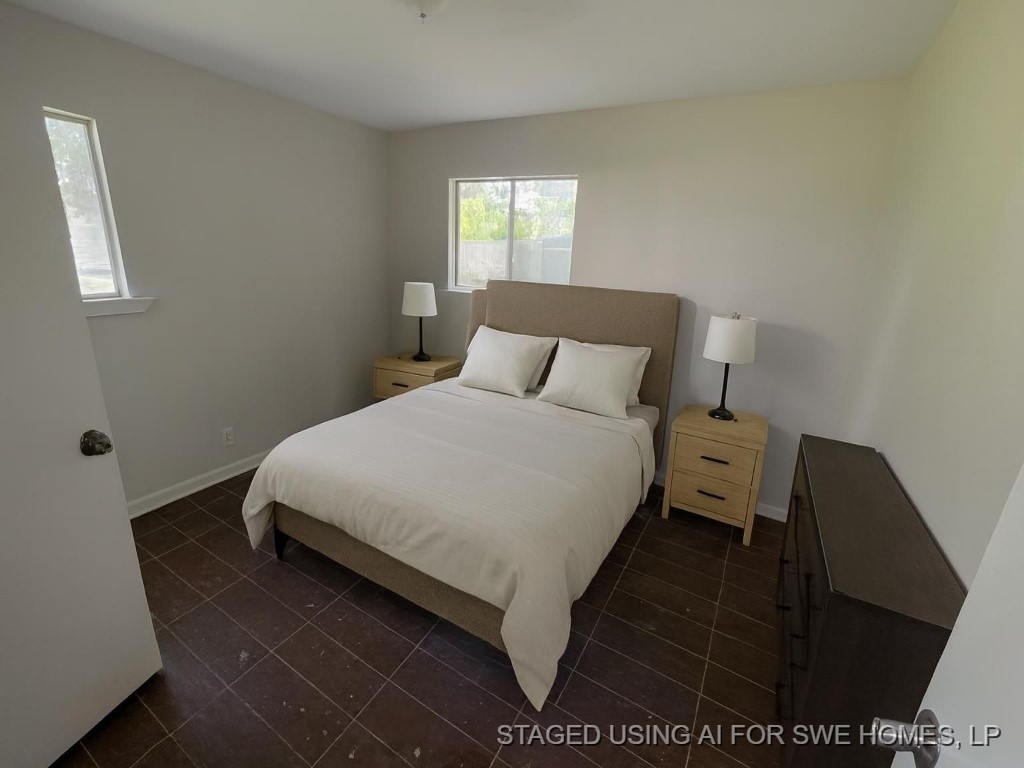 270 Triangle Drive Vidor, TX 77662 - Photo 26 of 29 a bed sitting in a bedroom next to a window