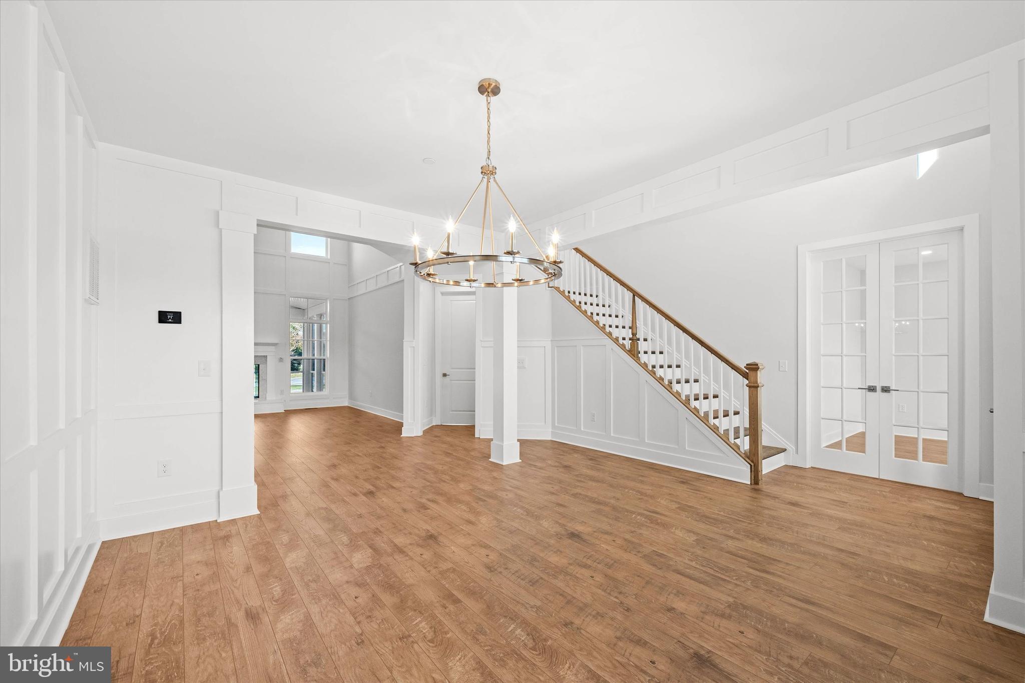 11809 River Run Lane Berlin, MD 21811 - Photo 39 of 95 a view of a room with wooden floor and staircase