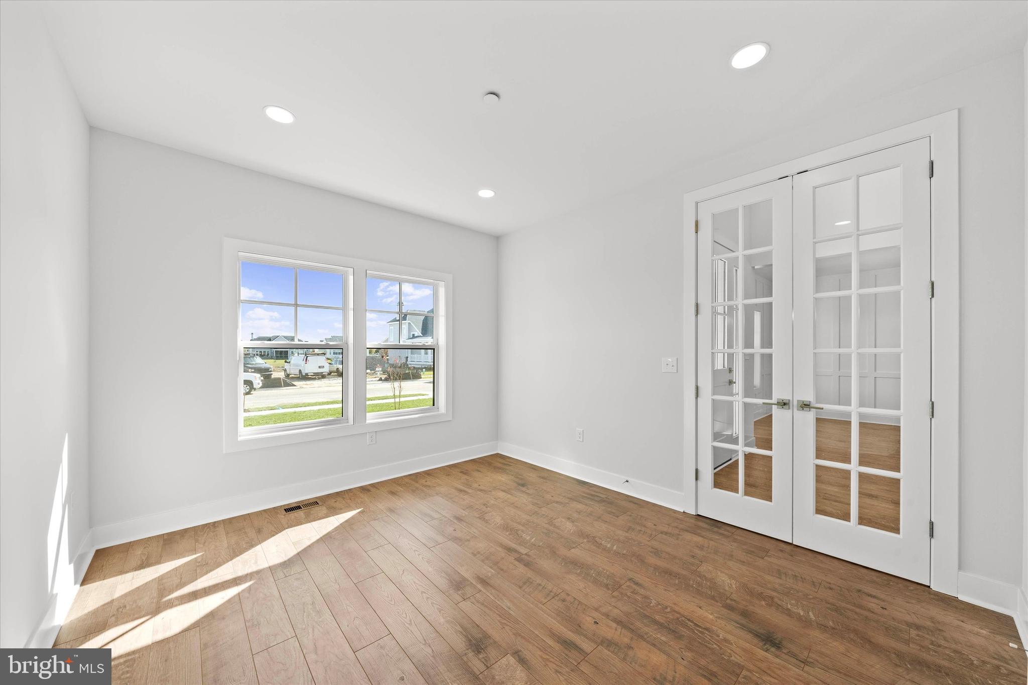 11809 River Run Lane Berlin, MD 21811 - Photo 69 of 95 a view of an empty room with wooden floor and a window