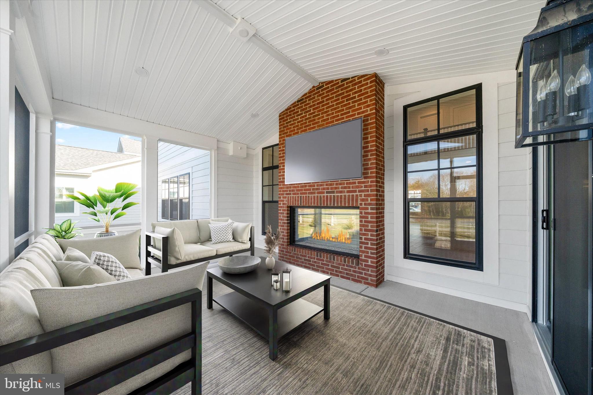 11809 River Run Lane Berlin, MD 21811 - Photo 82 of 95 a living room with furniture and a fireplace