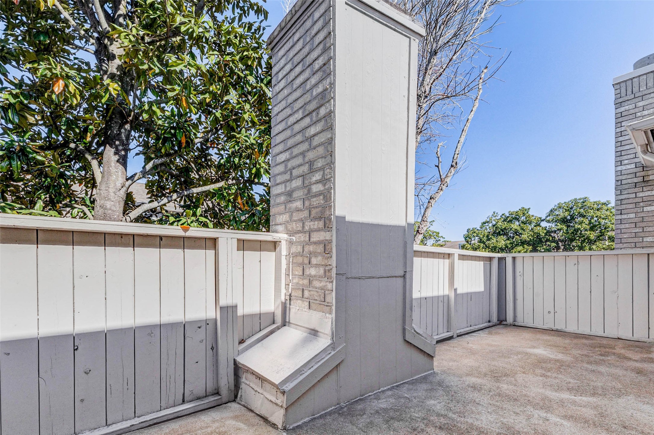 3800 Tanglewilde Street, Unit 102 Houston, TX 77063 - Photo 17 of 28 a view of entryway with wooden fence