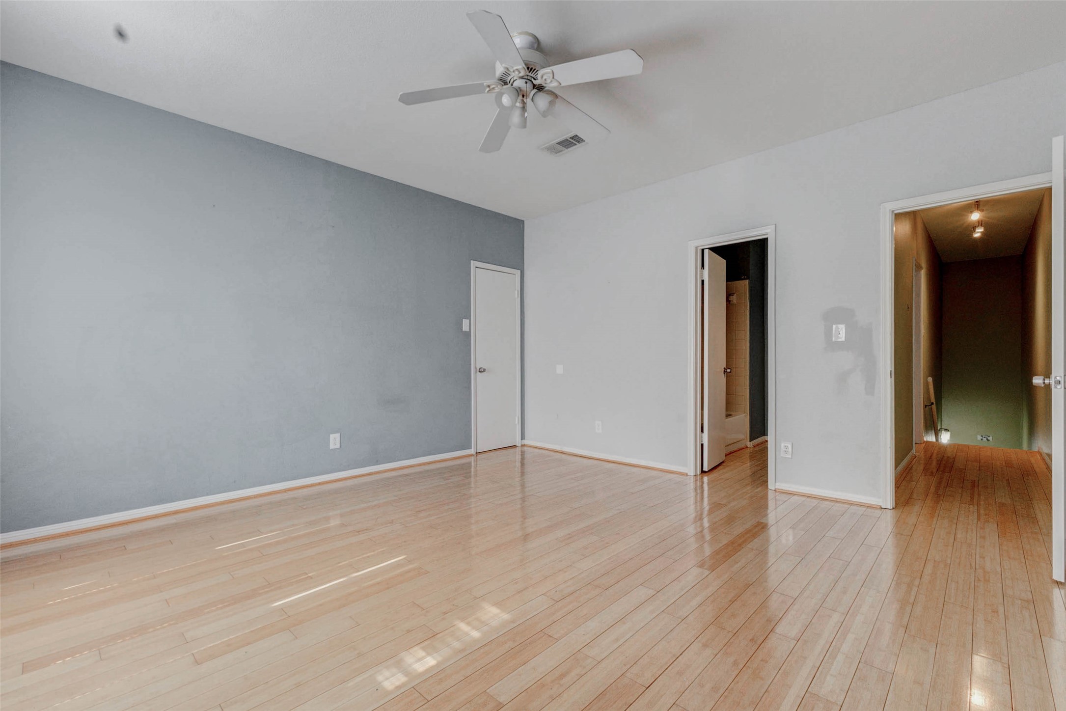 3800 Tanglewilde Street, Unit 102 Houston, TX 77063 - Photo 8 of 28 a view of an empty room with wooden floor