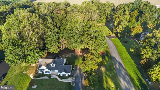 aerial view of a house with a yard