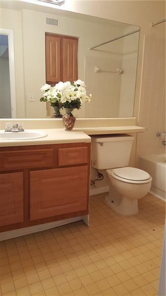 4541 West McNab Road, Unit 26 Pompano Beach, FL 33069 - Photo 4 of 12 a bathroom with a sink toilet and mirror