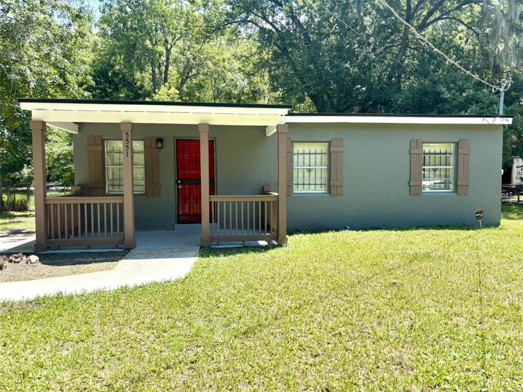 a balcony view with a garden