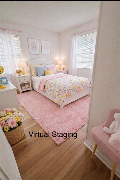 5551 Verbena Road Jacksonville, FL 32209 - Photo 12 of 13 a bedroom with a bed and a window