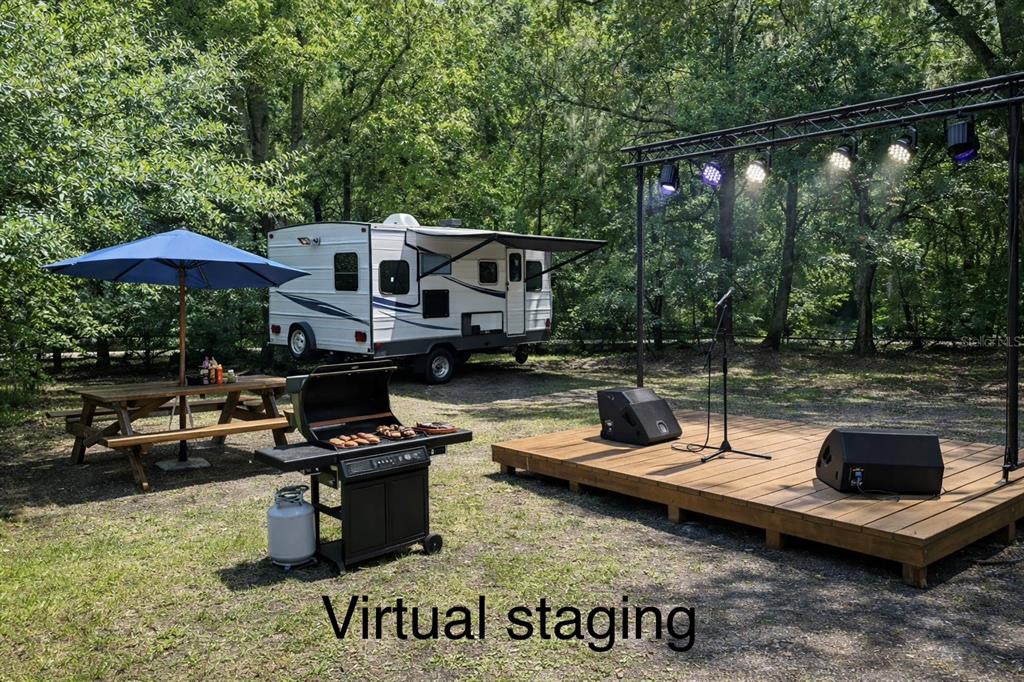 5551 Verbena Road Jacksonville, FL 32209 - Photo 13 of 13 a view of a house with backyard sitting area and swimming pool