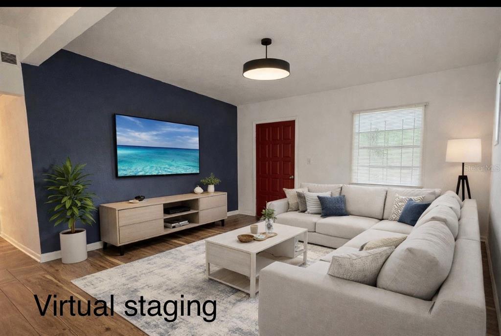 5551 Verbena Road Jacksonville, FL 32209 - Photo 3 of 13 a living room with furniture and a flat screen tv