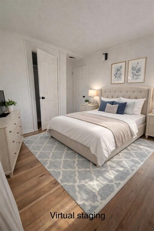 5551 Verbena Road Jacksonville, FL 32209 - Photo 10 of 13 a bedroom with a bed and wooden floor