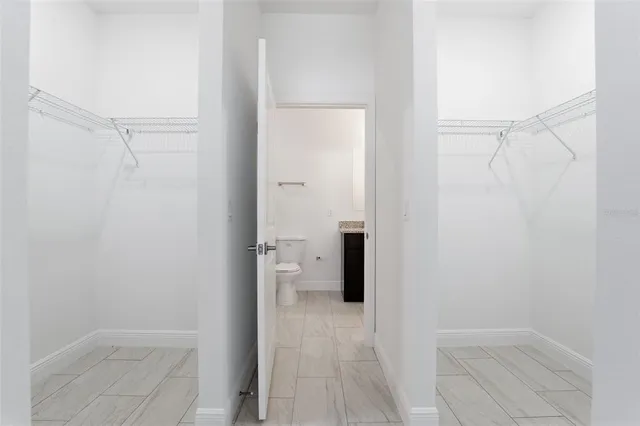 a bathroom with a granite countertop shower and a sink