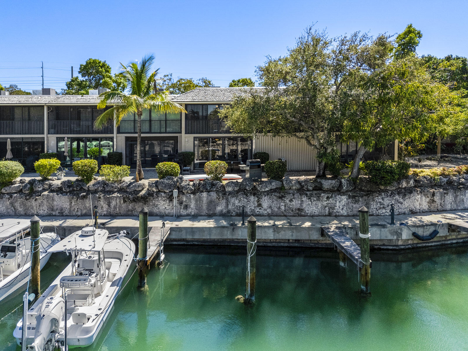 96000 Overseas Highway, Unit S3 AND 29' BOAT SLIP Key Largo, FL 33037 - Photo 1 of 38 a picture of houses with outdoor space water view
