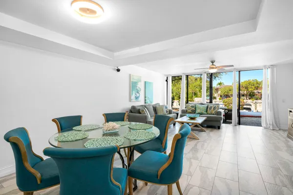 a kitchen with granite countertop a refrigerator and a stove