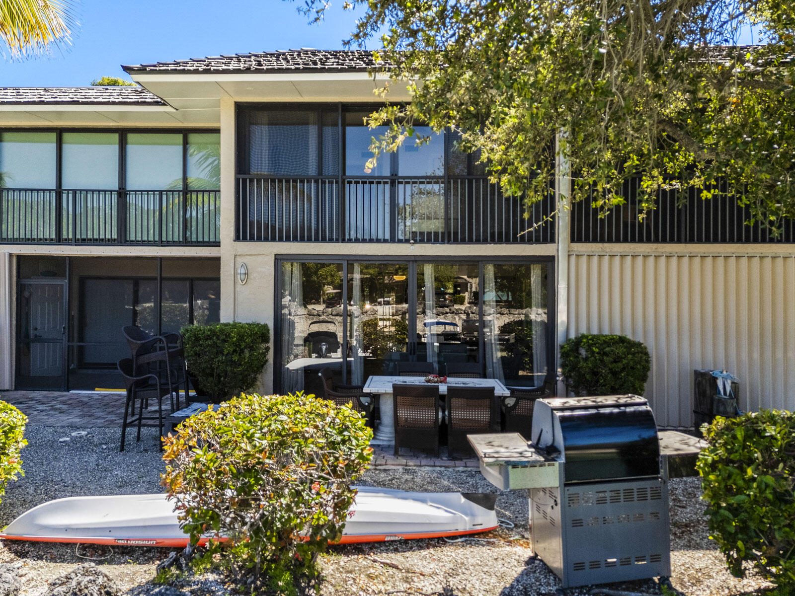 96000 Overseas Highway, Unit S3 AND 29' BOAT SLIP Key Largo, FL 33037 - Photo 22 of 38 a view of a house with sitting area and garden
