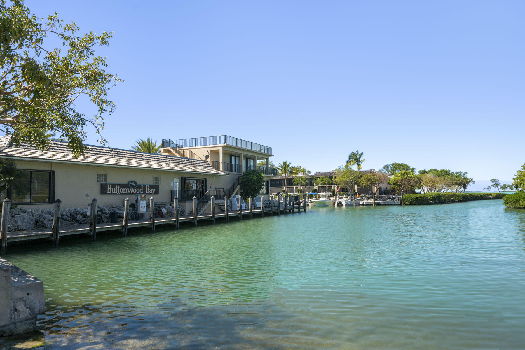 96000 Overseas Highway, Unit S3 AND 29' BOAT SLIP Key Largo, FL 33037 - Photo 25 of 38 a view of a lake with a garden and houses