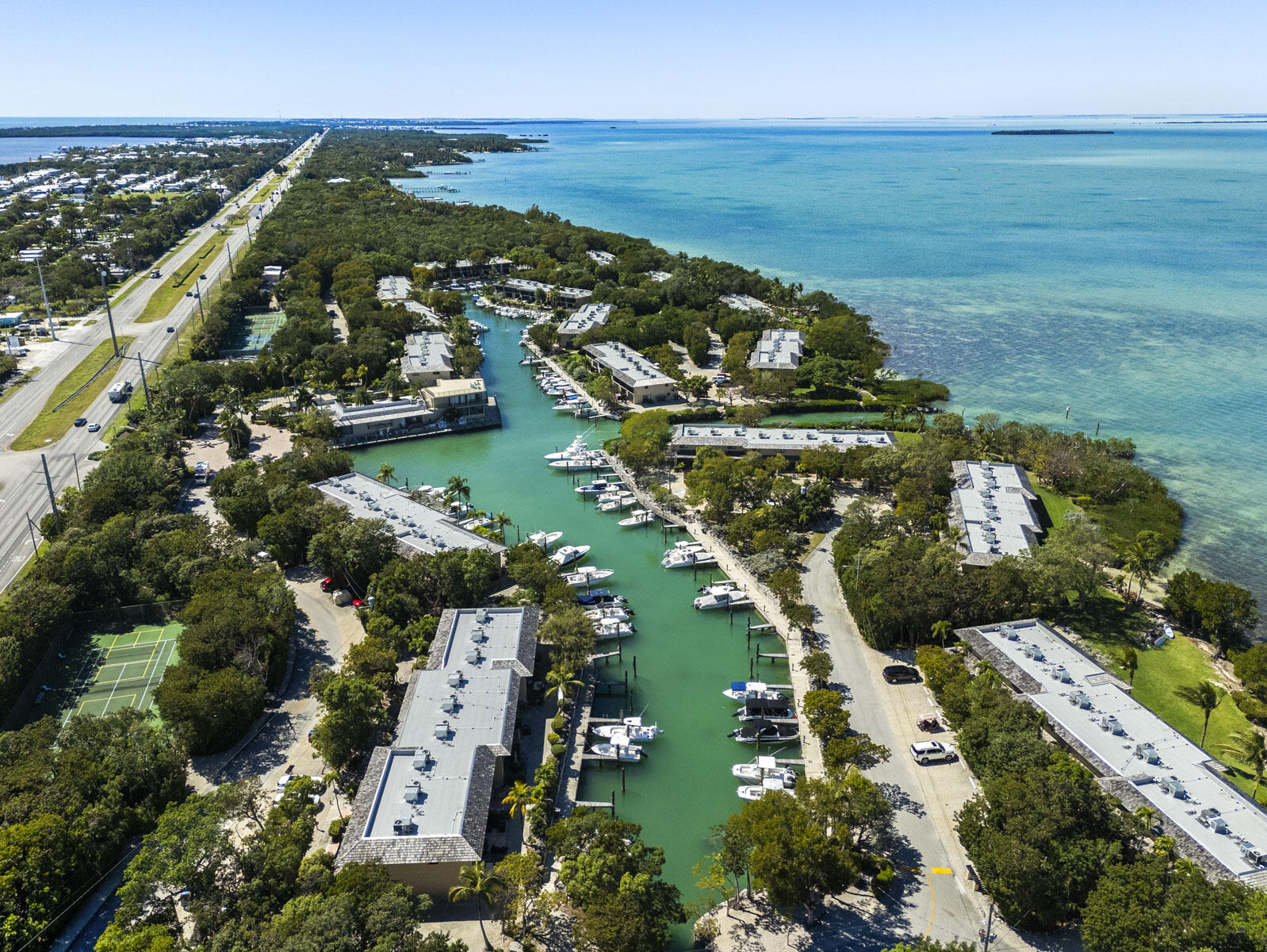 96000 Overseas Highway, Unit S3 AND 29' BOAT SLIP Key Largo, FL 33037 - Photo 26 of 38 an aerial view of ocean with residential house with outdoor space