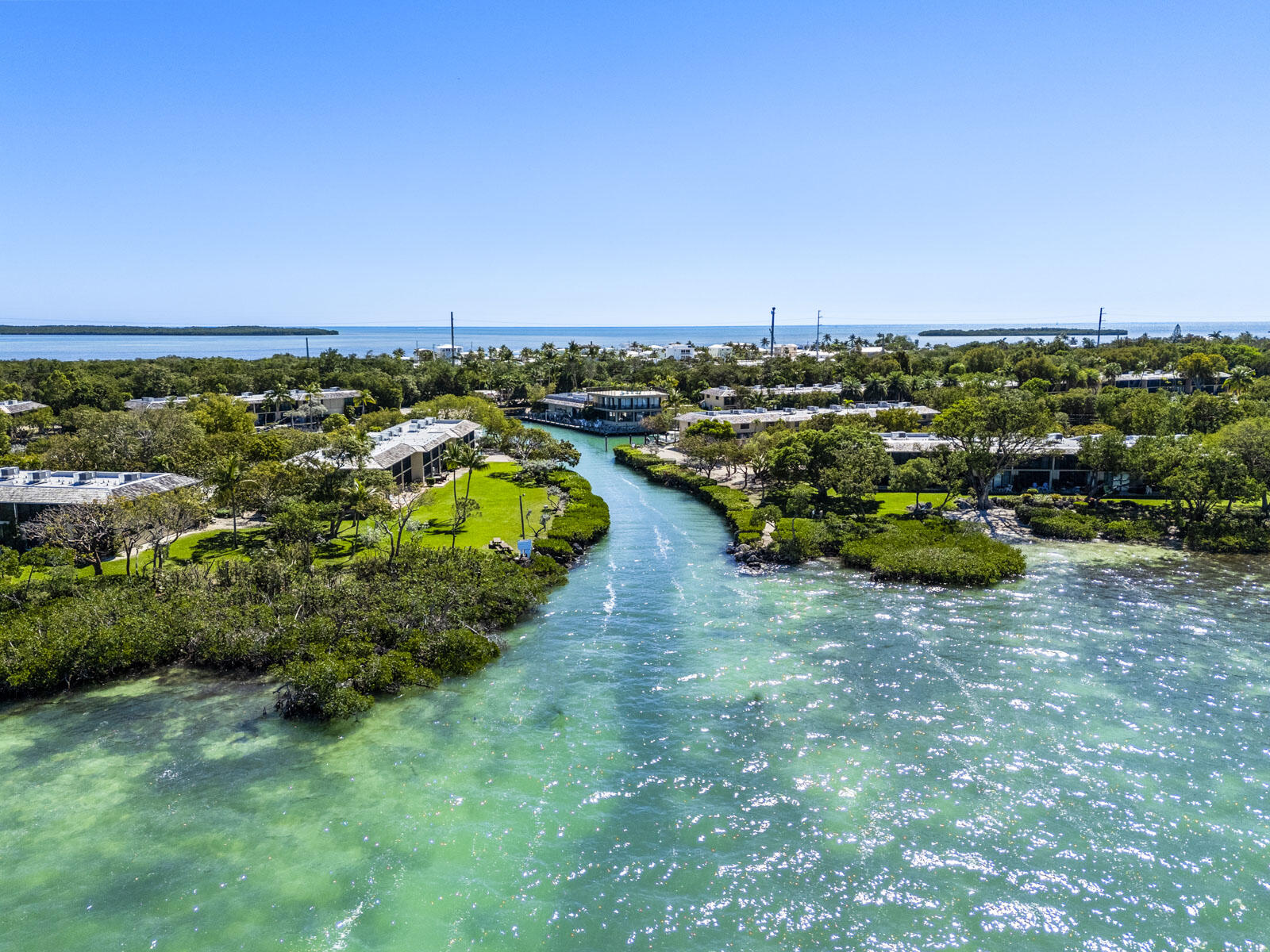 96000 Overseas Highway, Unit S3 AND 29' BOAT SLIP Key Largo, FL 33037 - Photo 34 of 38 an aerial view of a house with a yard
