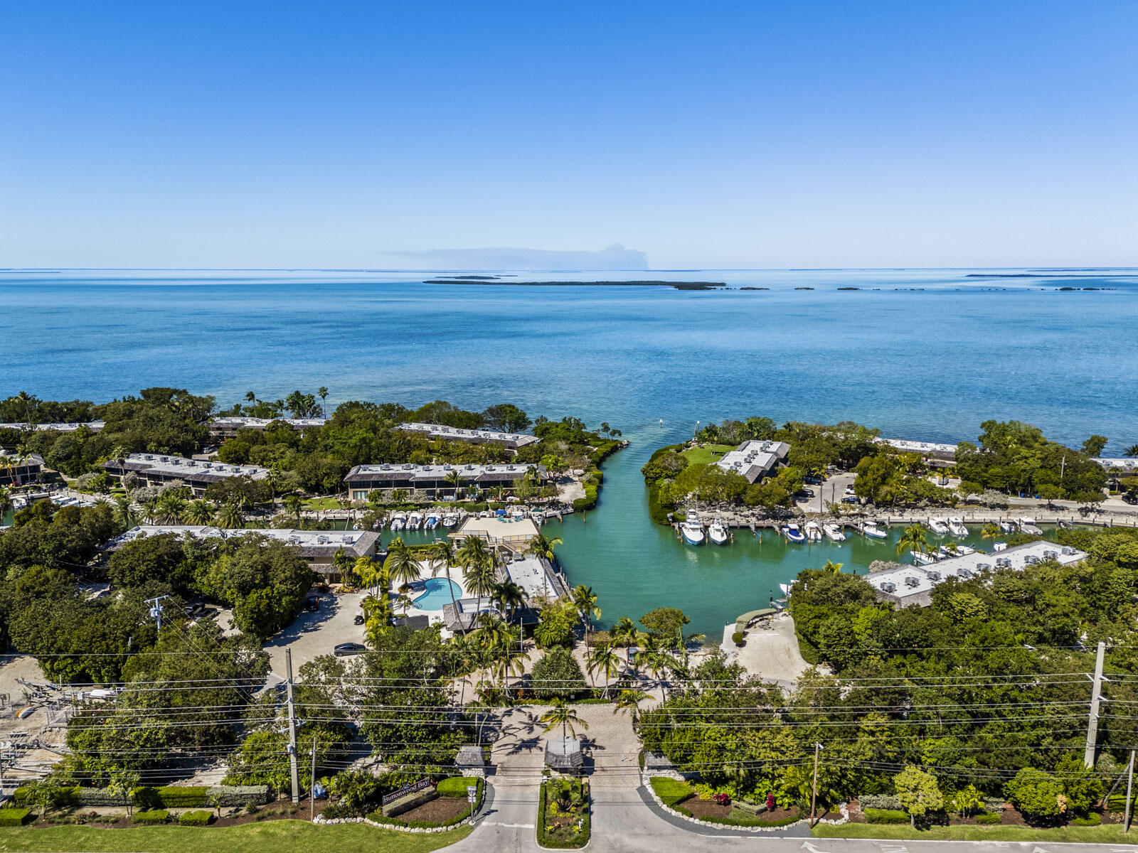 96000 Overseas Highway, Unit S3 AND 29' BOAT SLIP Key Largo, FL 33037 - Photo 36 of 38 a view of a lake with lawn chairs