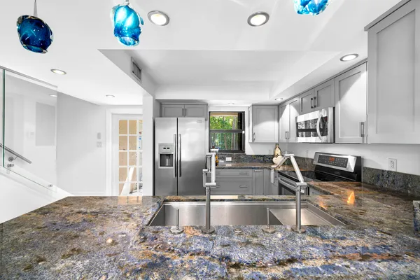 a living room with furniture and a ceiling fan