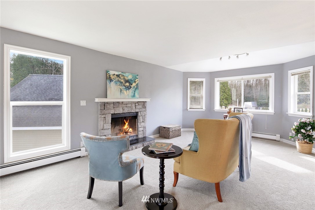 3190 Slater Road Ferndale, WA 98248 - Photo 22 of 40 a living room with furniture and a fireplace
