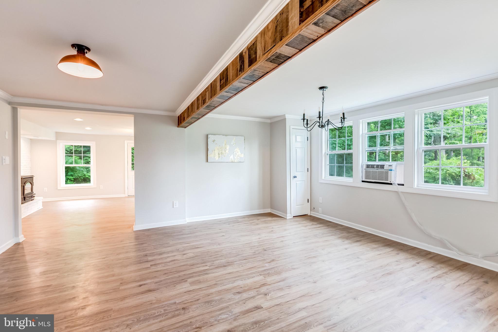 24436 Lenah Road Aldie, VA 20105 - Photo 13 of 39 a view of an empty room with wooden floor and a window
