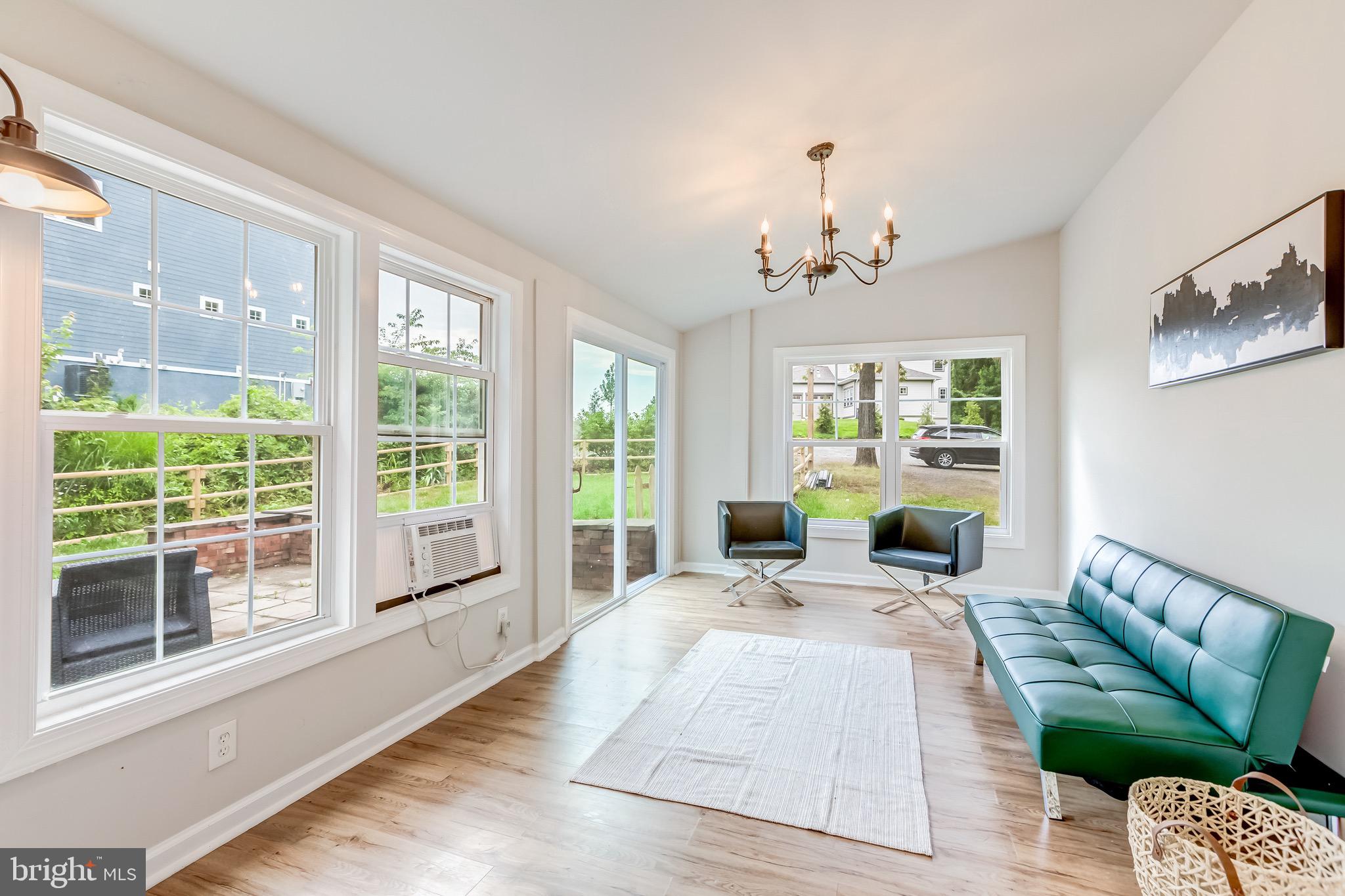 24436 Lenah Road Aldie, VA 20105 - Photo 15 of 39 a living room with furniture and a large window