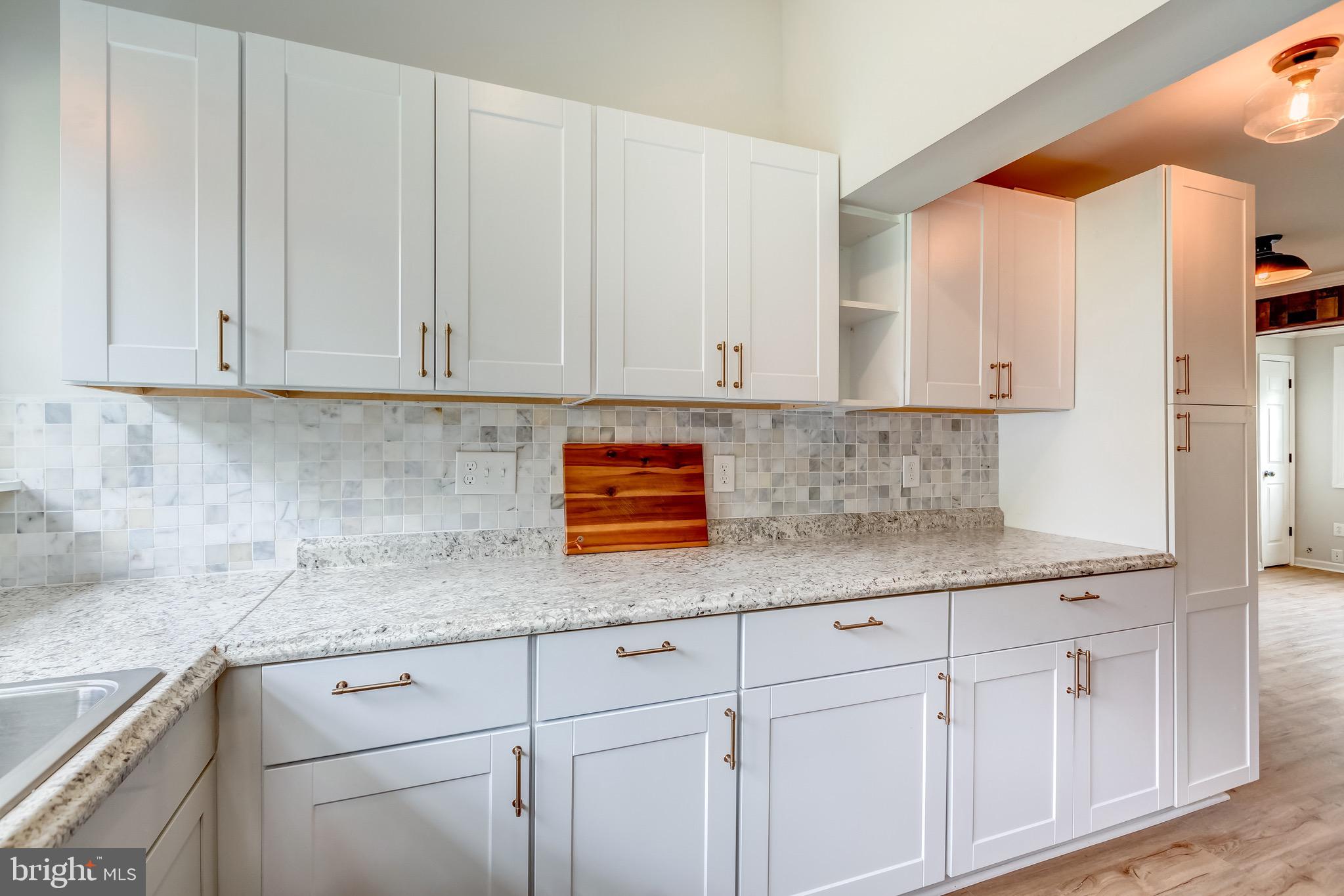 24436 Lenah Road Aldie, VA 20105 - Photo 19 of 39 a kitchen with stainless steel appliances granite countertop white cabinets sink and granite counter top