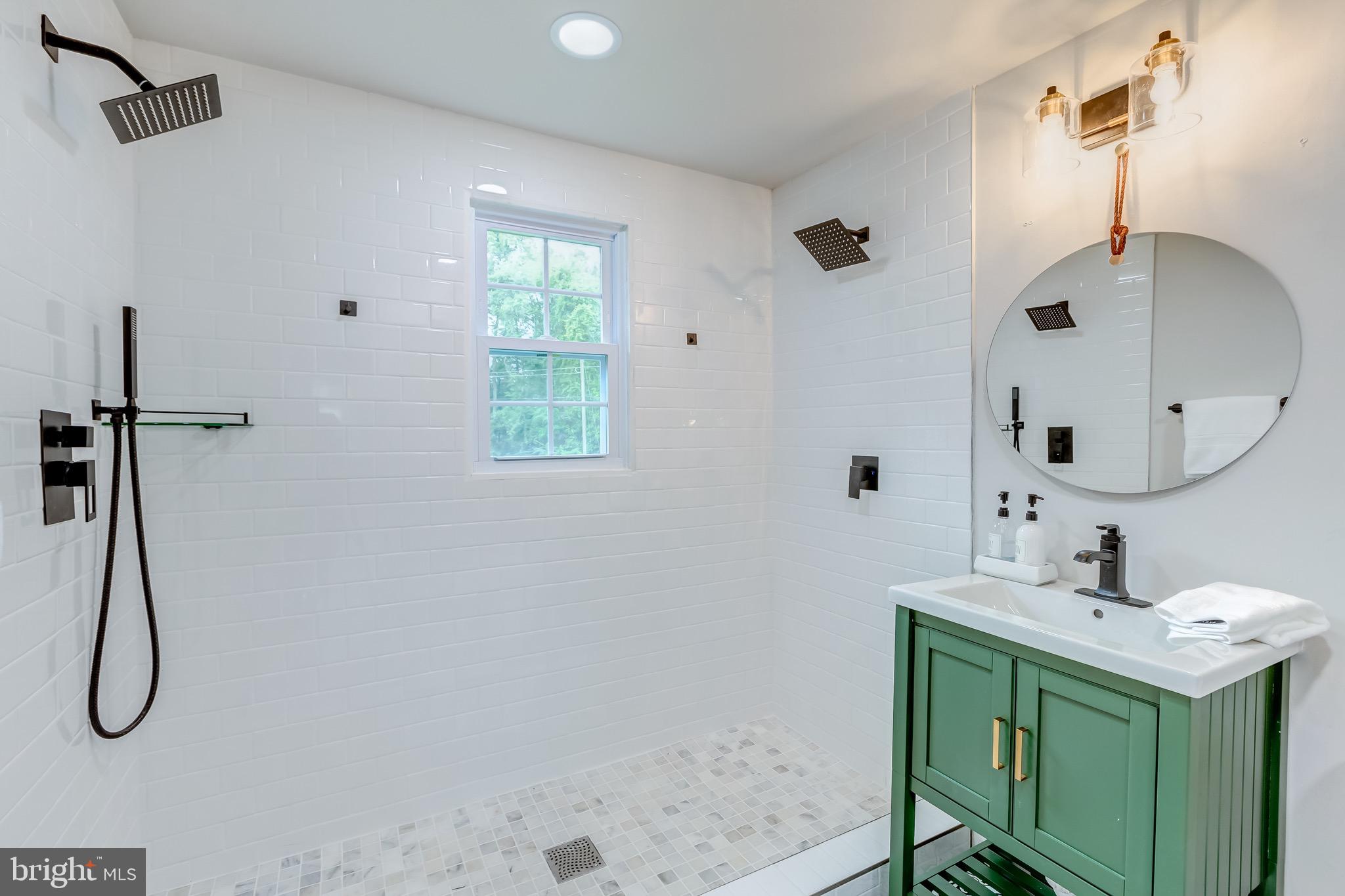 24436 Lenah Road Aldie, VA 20105 - Photo 23 of 39 a bathroom with a sink vanity and a mirror