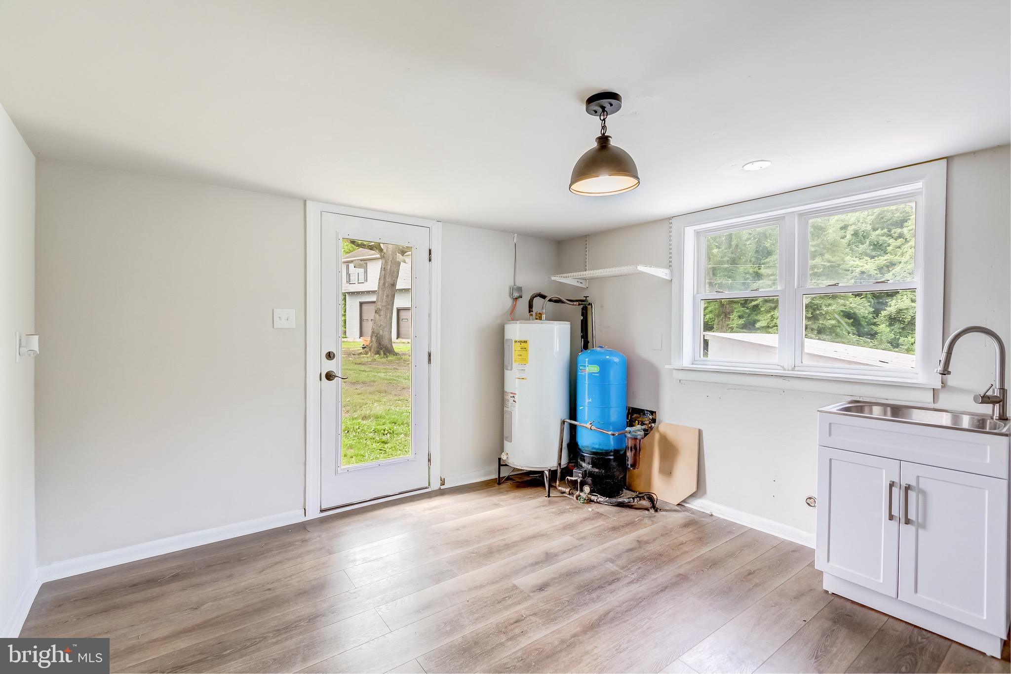 24436 Lenah Road Aldie, VA 20105 - Photo 25 of 39 a view of a livingroom with furniture hardwood floor and a window