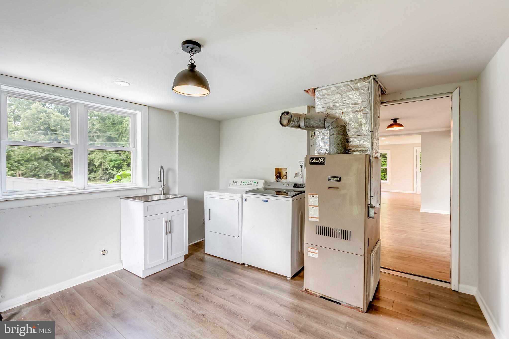 24436 Lenah Road Aldie, VA 20105 - Photo 26 of 39 a view of kitchen and hall with wooden floor