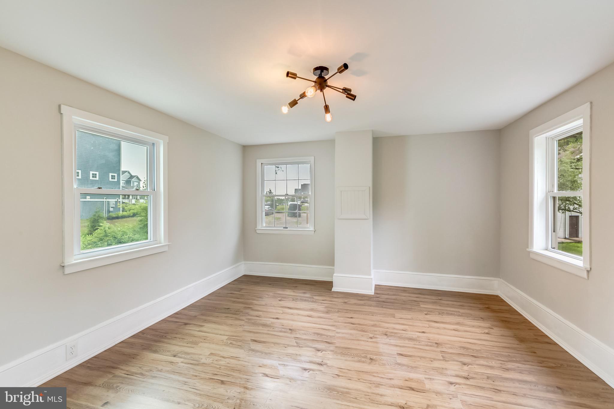 24436 Lenah Road Aldie, VA 20105 - Photo 30 of 39 a view of an empty room with wooden floor and a window