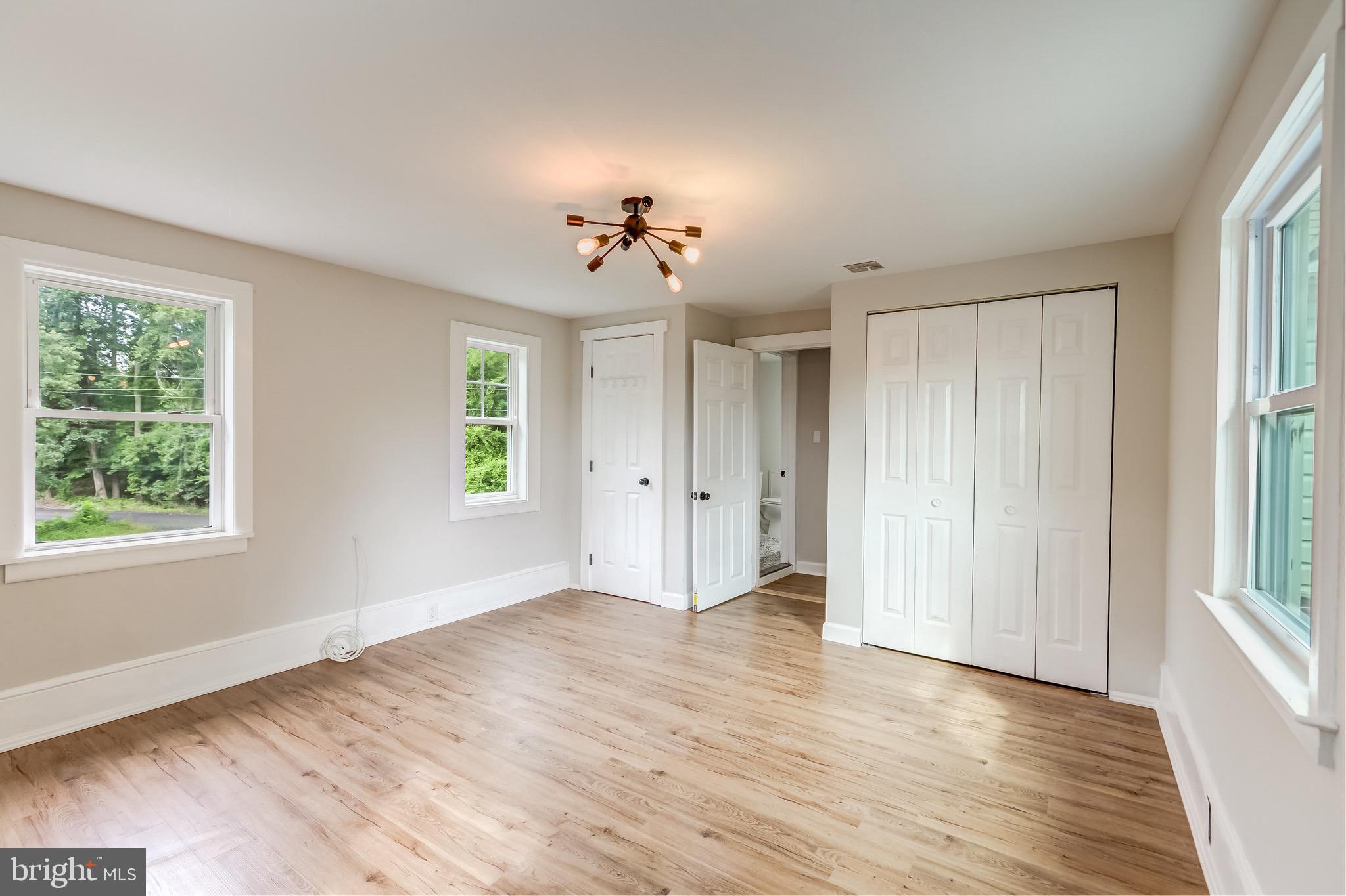 24436 Lenah Road Aldie, VA 20105 - Photo 31 of 39 a view of an empty room with a window and wooden floor