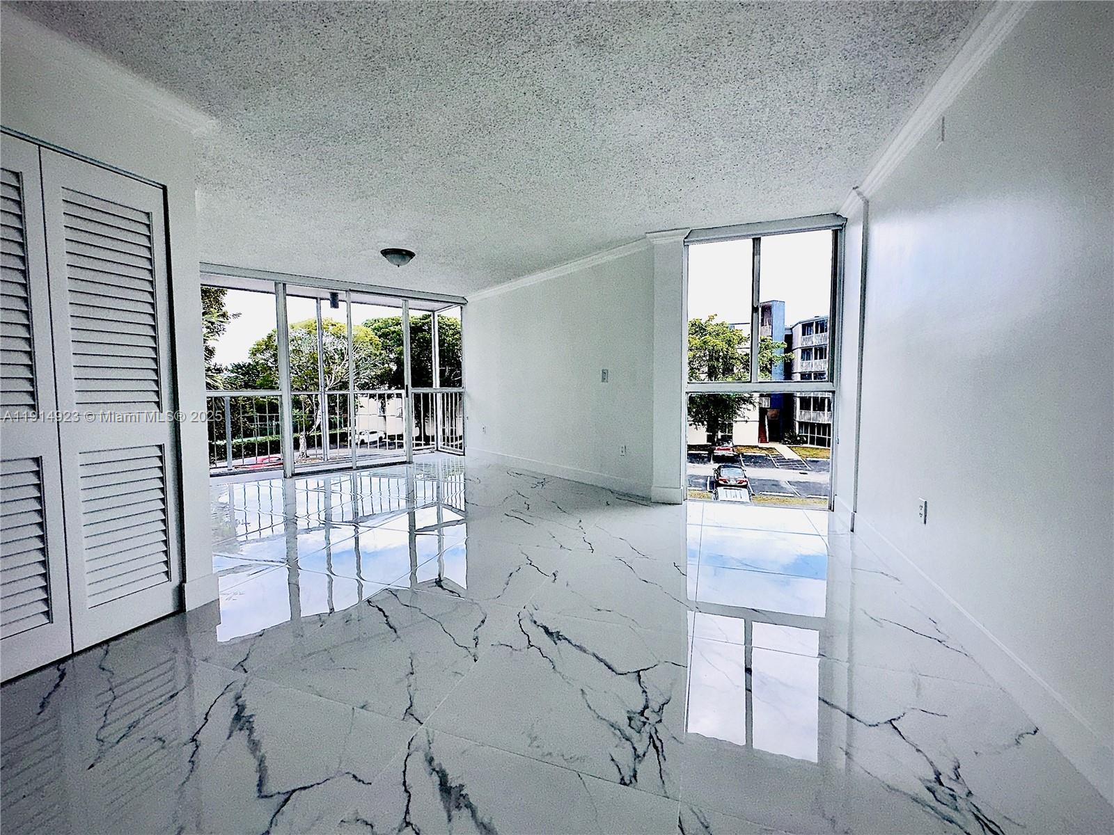 7125 Northwest 186th Street, Unit B311 Hialeah, FL 33015 - Photo 13 of 25 a room with a large window