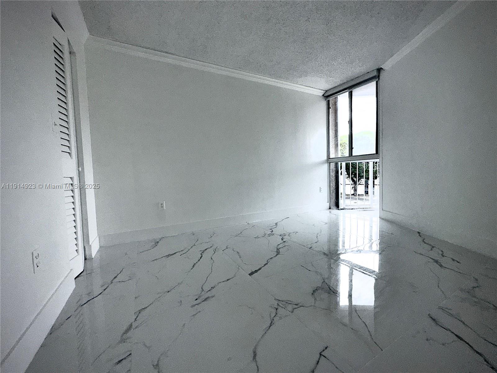 7125 Northwest 186th Street, Unit B311 Hialeah, FL 33015 - Photo 25 of 25 an empty room with windows