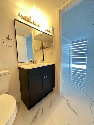 a view of empty room with windows